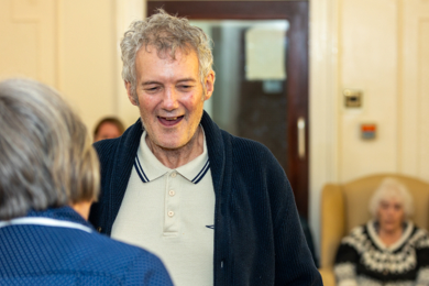 A resident enjoying a group social activity