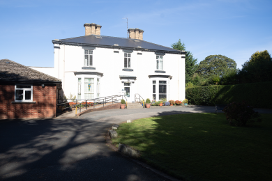 The Victorian Manor House exterior and front grounds