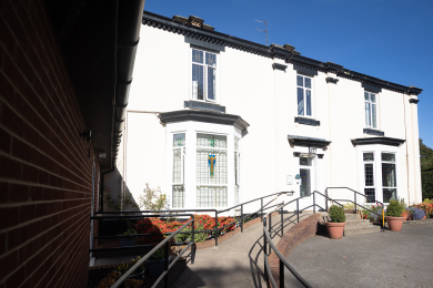 The front entrance and accessible ramp